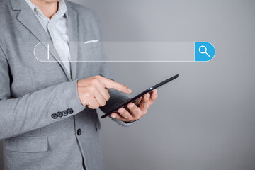 Businessman use a tablet to searching for information. Data search technology search engine optimization.
