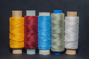 Multicolored bobbin thread. Polypropylene multifilament yarns. Set of sewing thread coils,