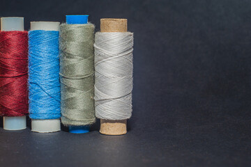 Multicolored bobbin thread. Polypropylene multifilament yarns. Set of sewing thread coils,