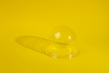 Transparent dome on yellow background. Minimal layout