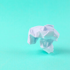 Crumpled paper in the form of walking legs on blue background