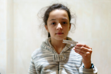 Girl with Coronavirus antigen test with negative result