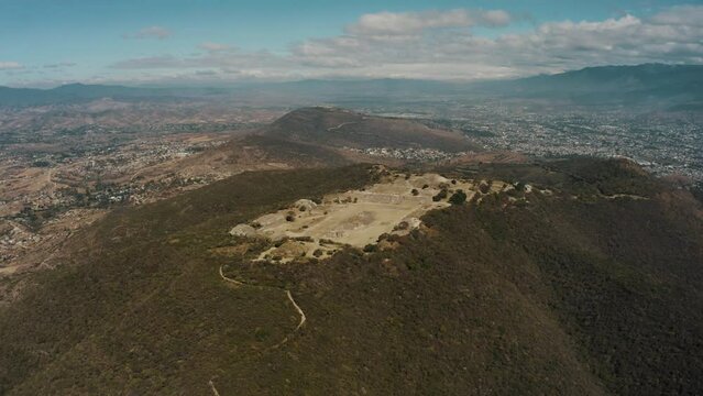 Aerial drone shot over the scenic view over the  Zapotecs Ancient Mesoamerican Pyramids,Monte Alban, Chiapas, Mexico on a bright sunny day.