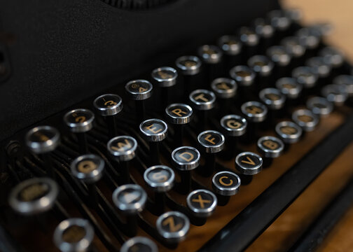 Old fashioned circular round type writer keys, vintage retro industrial style typing machine.