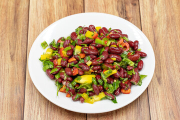 Mexican Bean Salad. Homemade black bean served in a ceramic plate, selective focus