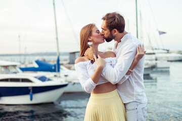 Kissing couple in love in the yacht club. Romantic, love concept