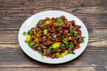 Mexican Bean Salad. Homemade black bean served in a ceramic plate, selective focus