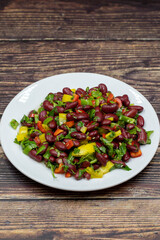 Mexican Bean Salad. Homemade black bean served in a ceramic plate, selective focus