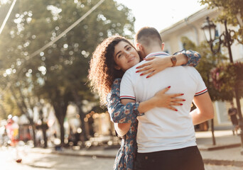 Young loving couple hugging in the city. Spend time together
