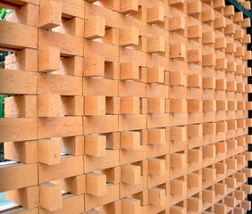 The wood is cut into squares stacked in a row.