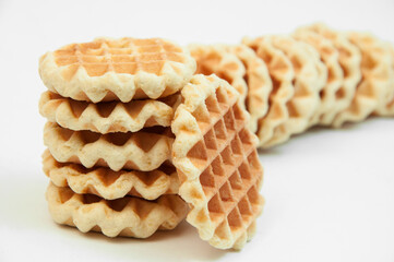 Belgian waffles on a table. holiday cookies on a white background. fresh baking concept. sweet desserts on a light texture
