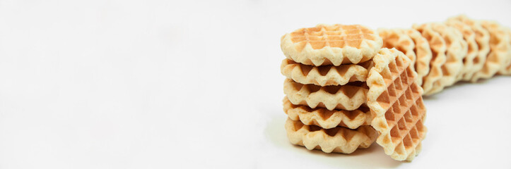 Belgian waffles on a table. holiday cookies on a white background. fresh baking concept. sweet desserts on a light texture