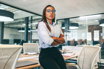 Confident black businesswoman looking thoughtful in a boardroom - obrazy, fototapety, plakaty