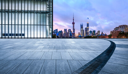 Fototapeta na wymiar Panoramic skyline and modern commercial buildings with empty square floor in Shanghai at night, China. empty road and cityscape.