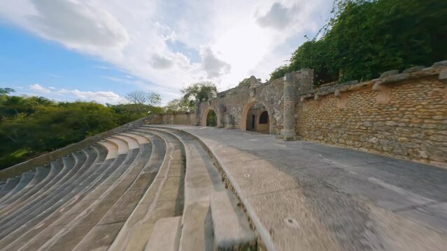 Aerial drone fpv flying over ancient amphitheater at Altos de Chavon, La Romana in Dominican Republic