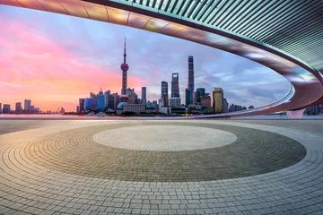 Deurstickers Panoramic skyline and modern commercial buildings with empty square floor in Shanghai at sunrise, China. empty floor and cityscape. © ABCDstock