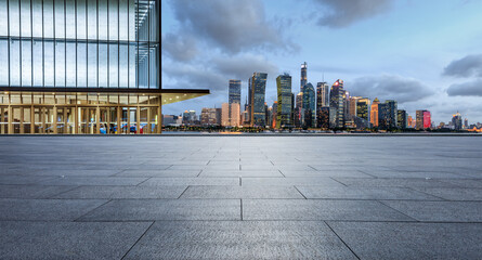 Fototapeta na wymiar Panoramic skyline and modern commercial office buildings with empty square floor in Shanghai at night, China. empty road and cityscape.