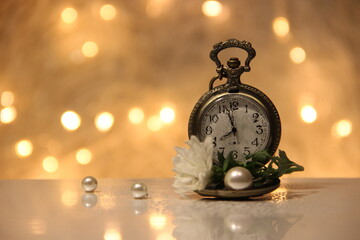 old watch with flower and pearls