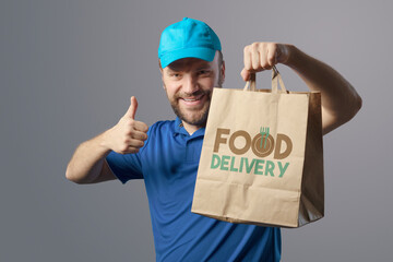 Happy delivery guy giving a thumbs up