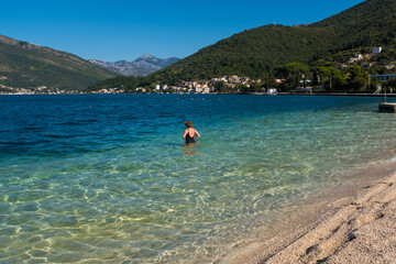 Fototapeta na wymiar Woman swim in Adriatic sea