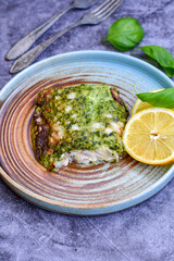 Fish bake refined with  spinach and gorgonzola cheese crust.White Code fish fillet stuffed  with broccoli  and  creamy Alfredo  sauce . Healthy food, delicious homemade italian  lunch .