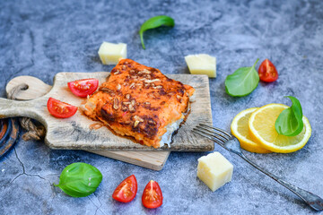 Fish bake preparated in Ticino style with sweet gorgonzola cheese and tomato crust