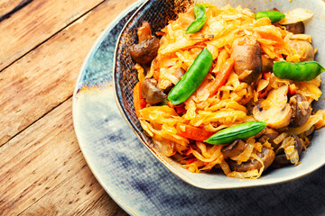 Tasty cabbage stewed with mushrooms.
