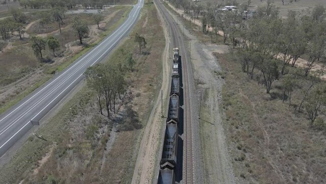Empty Coal Train Wagons Moving On The Railway In Far North Queensland In Australia. aerial drone following