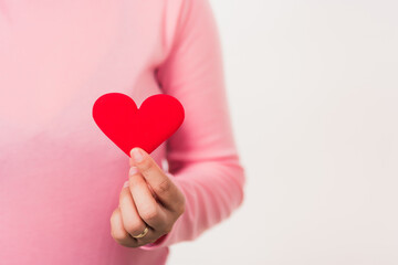 Obraz premium Love Valentine's Day. Woman beauty hands holding red heart for giving help donation medical healthcare concept isolated on white background, holiday background concept
