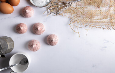 Homemade meringue. Homemade fresh meringue on a white table top with raspberry powder, made with egg white and sugar.