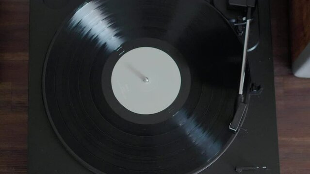 Vinyl record spins on record player