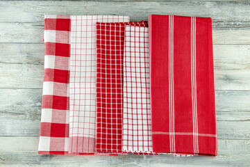 Top view of a set of empty red and white checkered and striped kitchen cloth, textile, tablecloth...