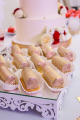 Candy bar and wedding cake. Table with sweets, buffet with cupcakes, candies, dessert.