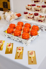 Candy bar and wedding cake. Table with sweets, buffet with cupcakes, candies, dessert.