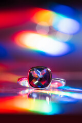 Cushion cut amethyst silver ring in rainbow neon light