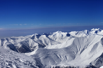 View on off-piste slopes and blue sky