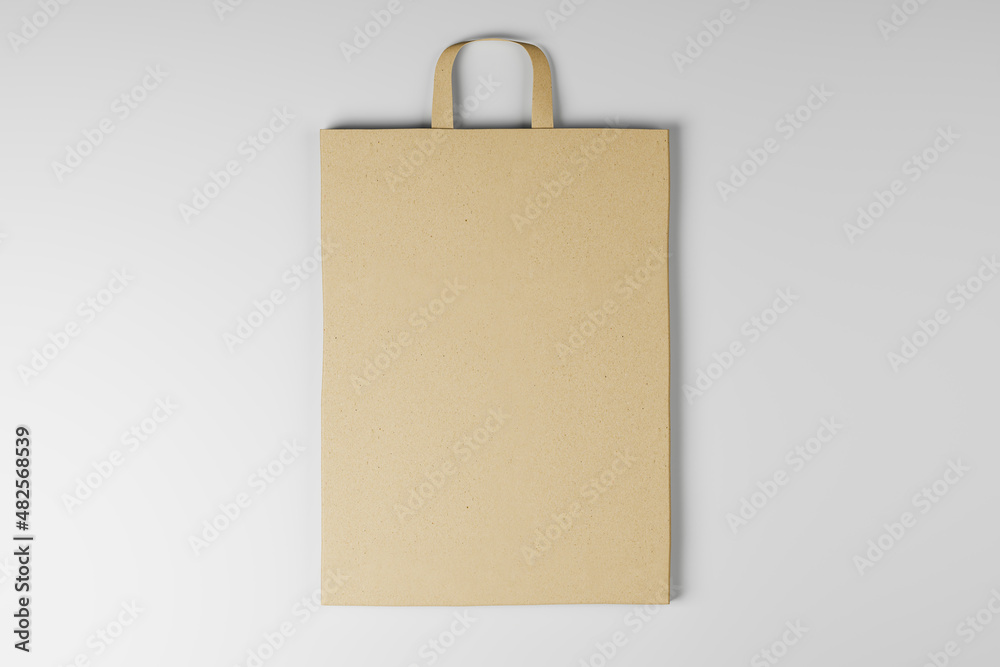 Wall mural close up of blank paper bag on white background. mock up place for your advertisement or logo. 3d re