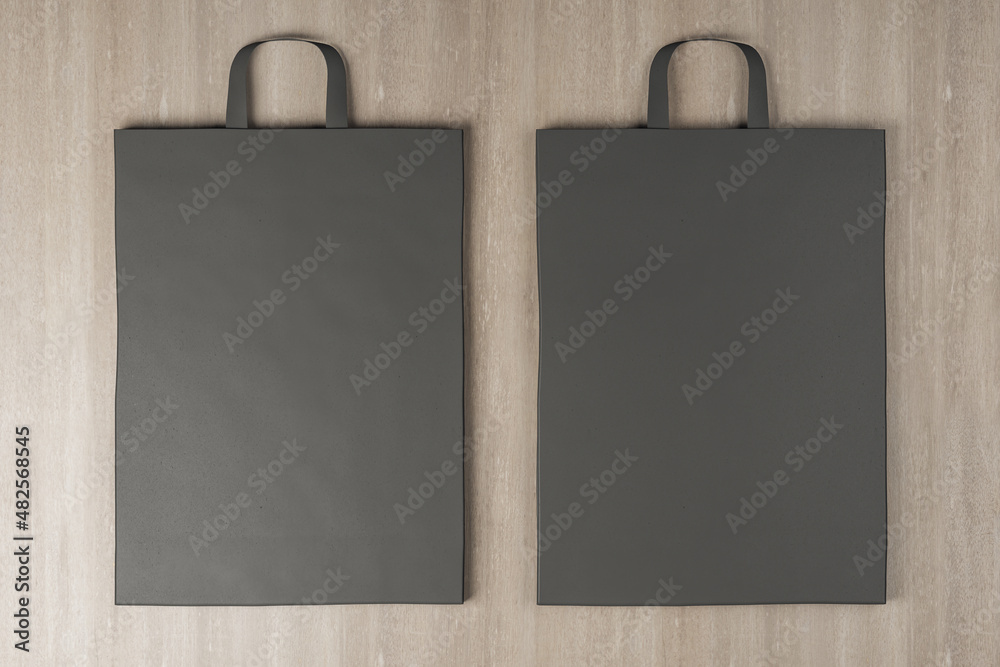 Poster close up of clean paper bag on wooden background. mock up place for your advertisement or logo. 3d r