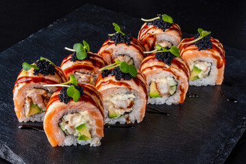Set fresh delicious Japanese sushi on dark background