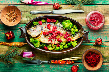 Appetizing gilthead fish in berry sauce.