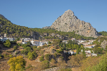 Fototapeta na wymiar Approaching Grazalema, a typical white village, seen from an outlook at the east entrance of the village