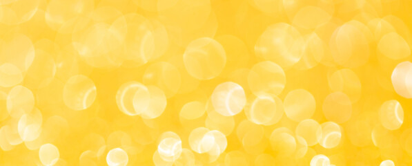 sparkles of yellow glitter abstract background. Copy space