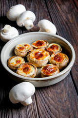 Stuffed mushroom caps with cheese and other stuffing, stuffed mushrooms. Georgian cuisine concept, traditional dish.