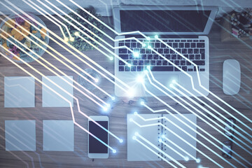 Double exposure of data theme drawing hologram over topview work table background with computer. Concept of technology.