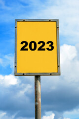 Sign with blue sky showing a date of 2023