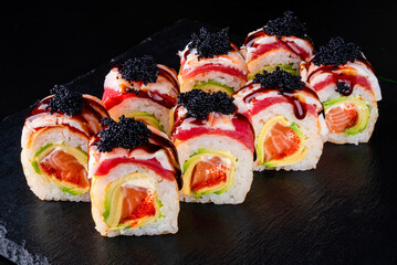 Set fresh delicious Japanese sushi on dark background