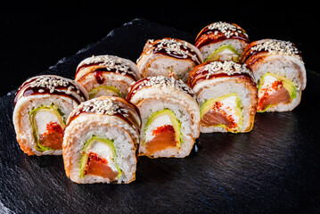 Set fresh delicious Japanese sushi on dark background