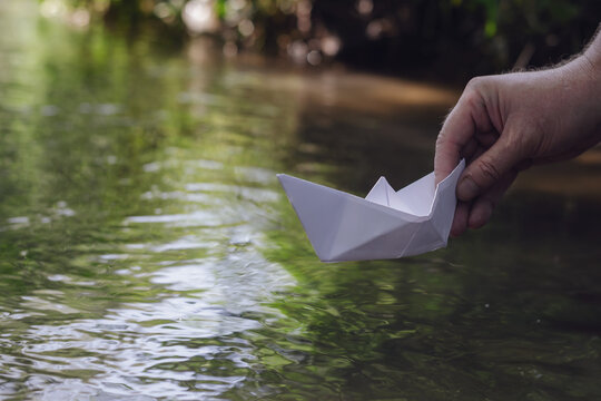 Man holds the homemade boat.