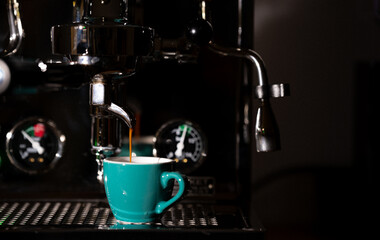 poressional portafilter coffee maker pouring coffee and espresso in close up