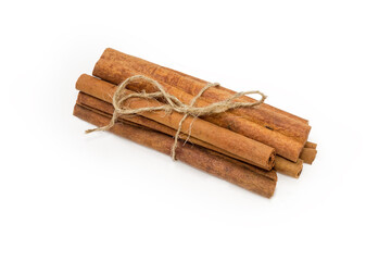 Bundle of cinnamon sticks on a white background